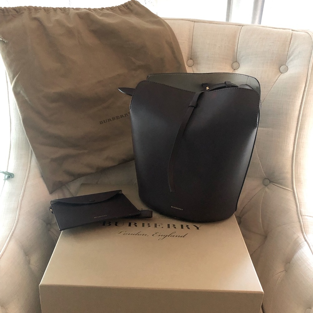 Burberry bucket style handbag with wristlet.